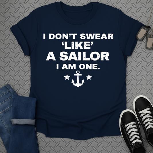 Navy t-shirt with white text "I don't swear like a sailor. I am one." and an anchor.